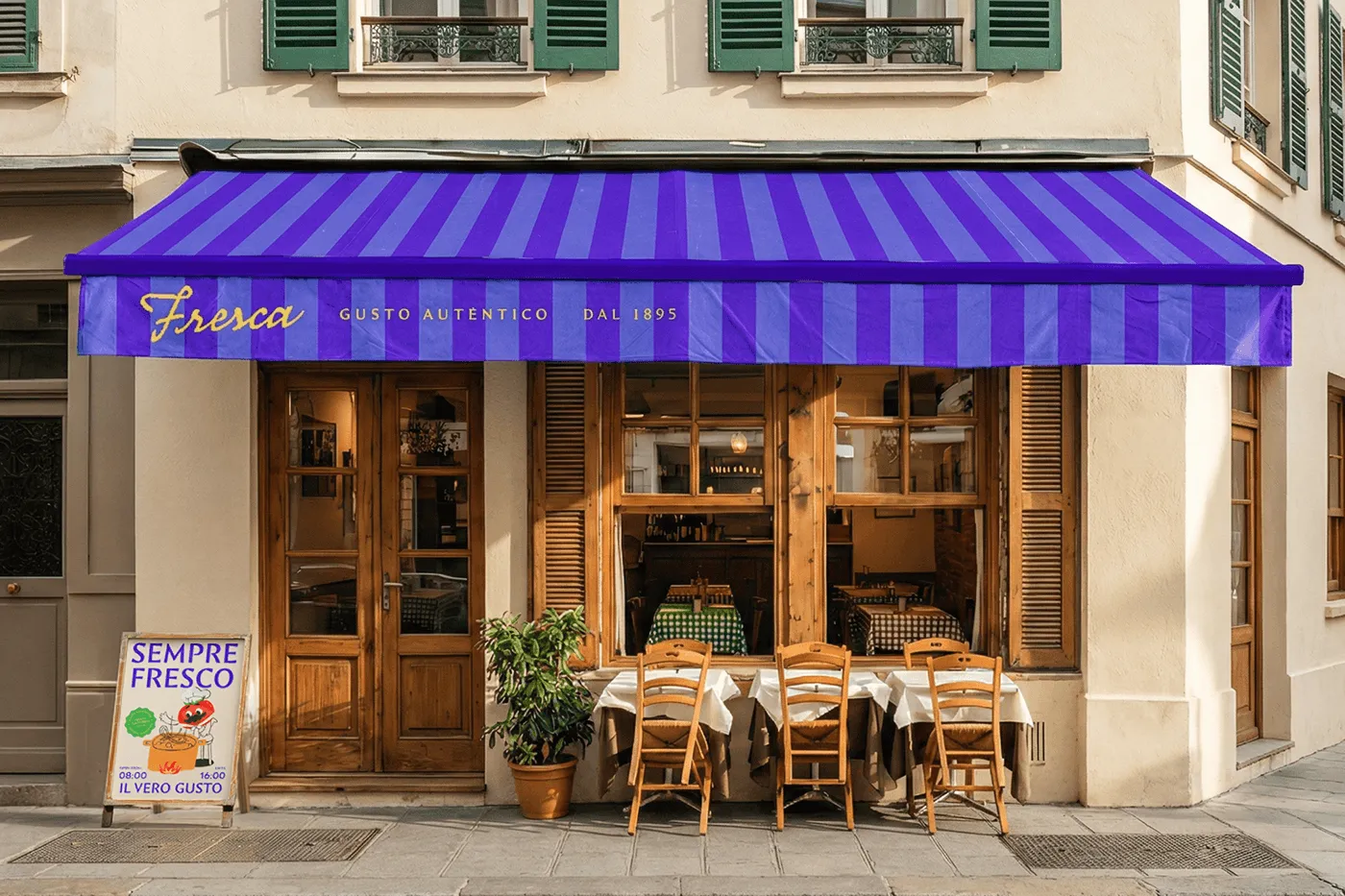 Restaurant exterior with the striped awning and gold script logo. The hero that sells the whole brand in context.